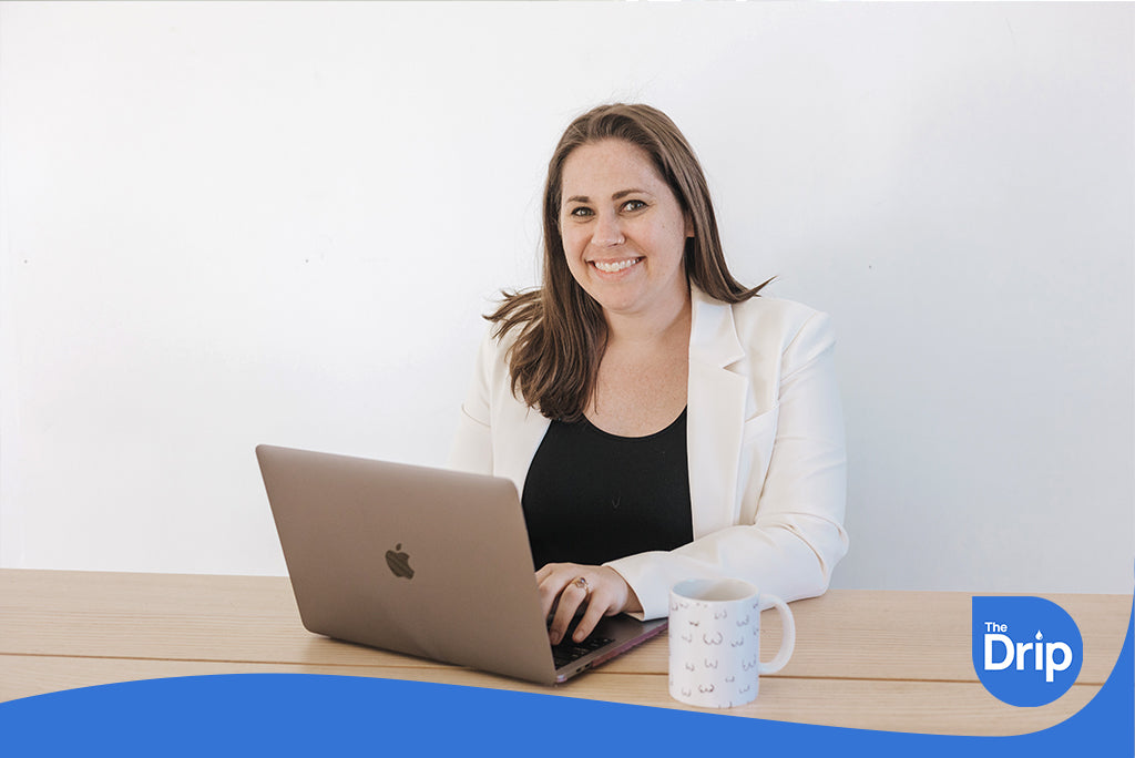 Dr. Hope Lima sitting at a desk using a laptop.